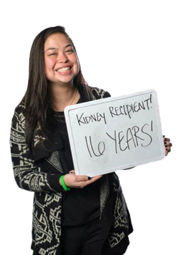 woman holding a sign that says kidney recipient! 16 years